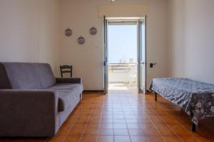 A bed or beds in a room at Casa Vacanza Maria