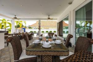 a dining room with a table and chairs at Private 3 Bedroom Pool Villa PP10 in Hua Hin