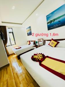 Säng eller sängar i ett rum på Ngọc Bích Home Huế