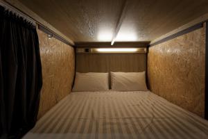 Voodi või voodid majutusasutuse Ximen Wow Hostel toas