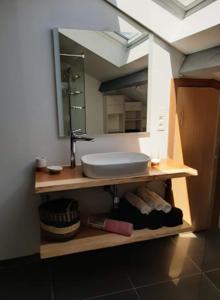 a bathroom with a sink and a mirror at Gîte La Columbia Lens en Hainaut in Cambron-Saint-Vincent