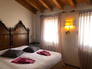 Postel nebo postele na pokoji v ubytování Agriturismo Terre Bianche