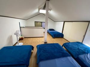 Postel nebo postele na pokoji v ubytování 秩父 思源屋