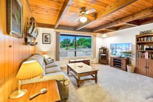 a living room with a couch and a table at Brathouse By The Sea in Copalis Beach
