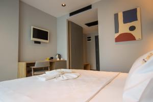 Postel nebo postele na pokoji v ubytování SHERLOCK HOMES HOTELS