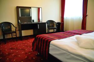 Postel nebo postele na pokoji v ubytování Hotel Roberts