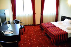 Postel nebo postele na pokoji v ubytování Hotel Roberts