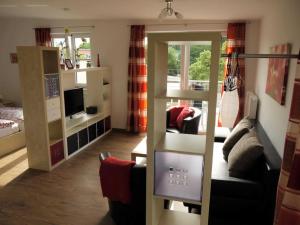 Μια τηλεόραση ή/και κέντρο ψυχαγωγίας στο Haus vier Elemente _br_ Ferienhaus +31 φωτογραφίες