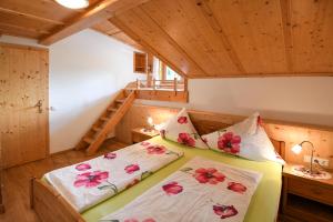 a bedroom with two beds in a room at Strickhof in Schladming