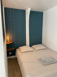 Postel nebo postele na pokoji v ubytování Le Studio Cosy