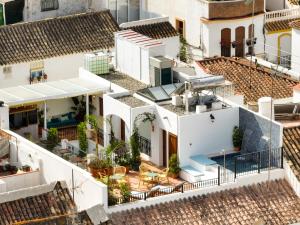an aerial view of a white house with roofs at Veranera Hostel in Estepona