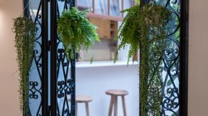 a wrought iron gate with potted plants on it at Veranera Hostel in Estepona
