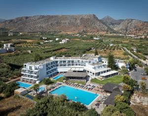 an aerial view of the hotel and the swimming pool at Sentido Amounda Bay in Amoudara Herakliou