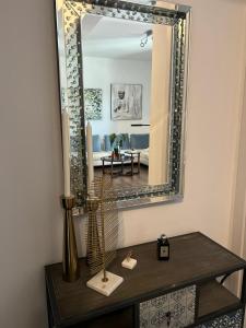 a mirror on a table in a living room at Sea View Residence by MD in Alexandroupoli +45 photos