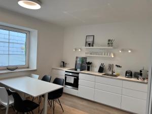 Kuchyň nebo kuchyňský kout v ubytování Lieblingsplatz Neusiedl Appartement - Erhol dich gut