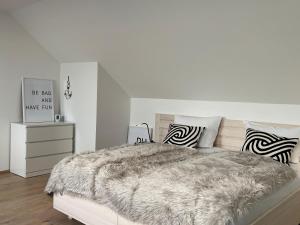 Postel nebo postele na pokoji v ubytování Lieblingsplatz Neusiedl Appartement - Erhol dich gut