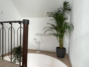 Postel nebo postele na pokoji v ubytování Lieblingsplatz Neusiedl Appartement - Erhol dich gut