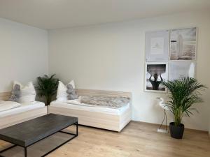 Postel nebo postele na pokoji v ubytování Lieblingsplatz Neusiedl Appartement - Erhol dich gut