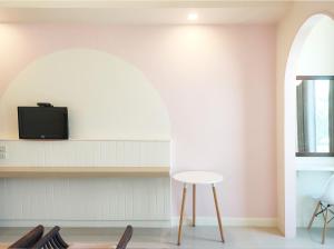 a room with chairs and a table and a tv at Chiangmai residence in Chiang Mai +22 photos