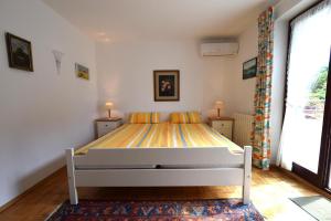 Łóżko lub łóżka w pokoju w obiekcie Apartments Cordasev