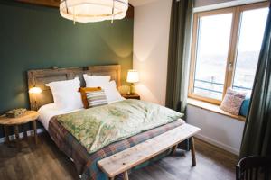 a bedroom with a large bed and a window at Chambre spacieuse Le clos des vignes in Chavanay