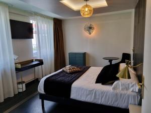 Posteľ alebo postele v izbe v ubytovaní Hôtel d'Angleterre Rouen Centre Gare