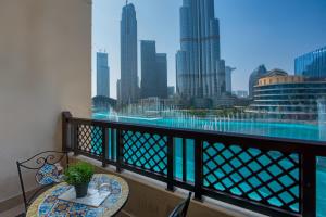 a balcony with a table and a view of the city at Durrani Homes - Heaven on Earth in Dubai