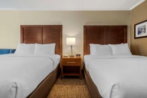 Ein Bett oder Betten in einem Zimmer der Unterkunft Comfort Inn Ocean City Boardwalk