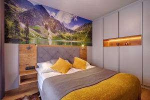 Posteľ alebo postele v izbe v ubytovaní GórSKI Przystanek Apartament Parzenica i Rozeta