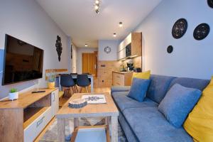 Kuchyňa alebo kuchynka v ubytovaní GórSKI Przystanek Apartament Parzenica i Rozeta