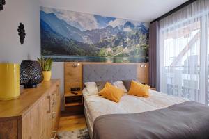 Posteľ alebo postele v izbe v ubytovaní GórSKI Przystanek Apartament Parzenica i Rozeta