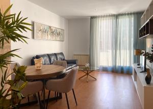 a living room with a couch and a table at Gran Hotel Don Manuel in Cáceres