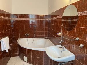 Koupelna v ubytování Hotel Ennius