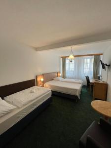 Postel nebo postele na pokoji v ubytování Hotel Ennius
