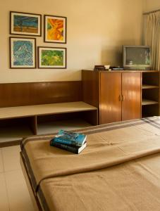 Postel nebo postele na pokoji v ubytování Atithi Guest House