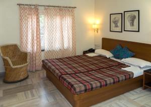 Postel nebo postele na pokoji v ubytování Atithi Guest House