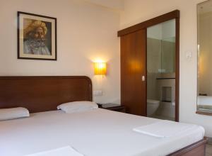Postel nebo postele na pokoji v ubytování Atithi Guest House