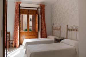 Postel nebo postele na pokoji v ubytování Hotel Manzanito