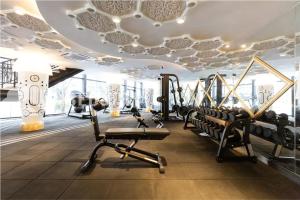 a gym with treadmills and cardio equipment in a room at Arte Mont Kiara Serviced Suites by Bedstay.MY in Kuala Lumpur