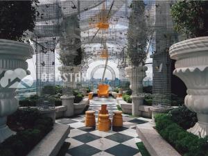a garden with a checkered floor in a building at Arte Mont Kiara Serviced Suites by Bedstay.MY in Kuala Lumpur