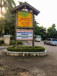 Ein Zertifikat, Auszeichnung, Logo oder anderes Dokument, das in der Unterkunft E 20 Mystic Ridge ocho Rios ausgestellt ist