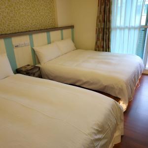 Postel nebo postele na pokoji v ubytování Lucky Star Homestay
