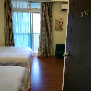 Postel nebo postele na pokoji v ubytování Lucky Star Homestay