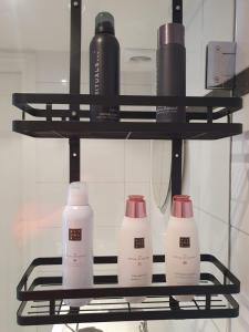 a shelf with three bottles of milk on it at Bij Ons Naast in Nuenen