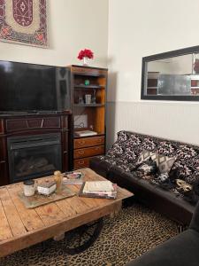 a living room with a couch and a coffee table at Redefined Alchemy LLC in Little Falls