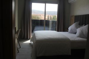 Voodi või voodid majutusasutuse HOTEL CAFE PALAIS SALAM , Beni Mellal toas