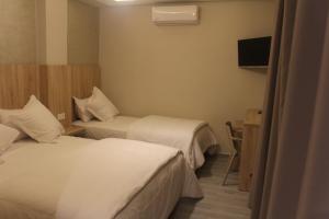 Voodi või voodid majutusasutuse HOTEL CAFE PALAIS SALAM , Beni Mellal toas