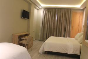 Voodi või voodid majutusasutuse HOTEL CAFE PALAIS SALAM , Beni Mellal toas