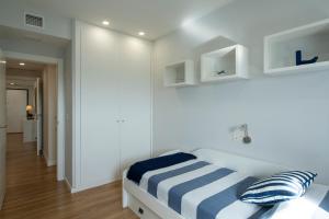 Posteľ alebo postele v izbe v ubytovaní GUNI SUITES JARDINEs