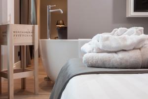 Posteľ alebo postele v izbe v ubytovaní Montalbera Wine Suites